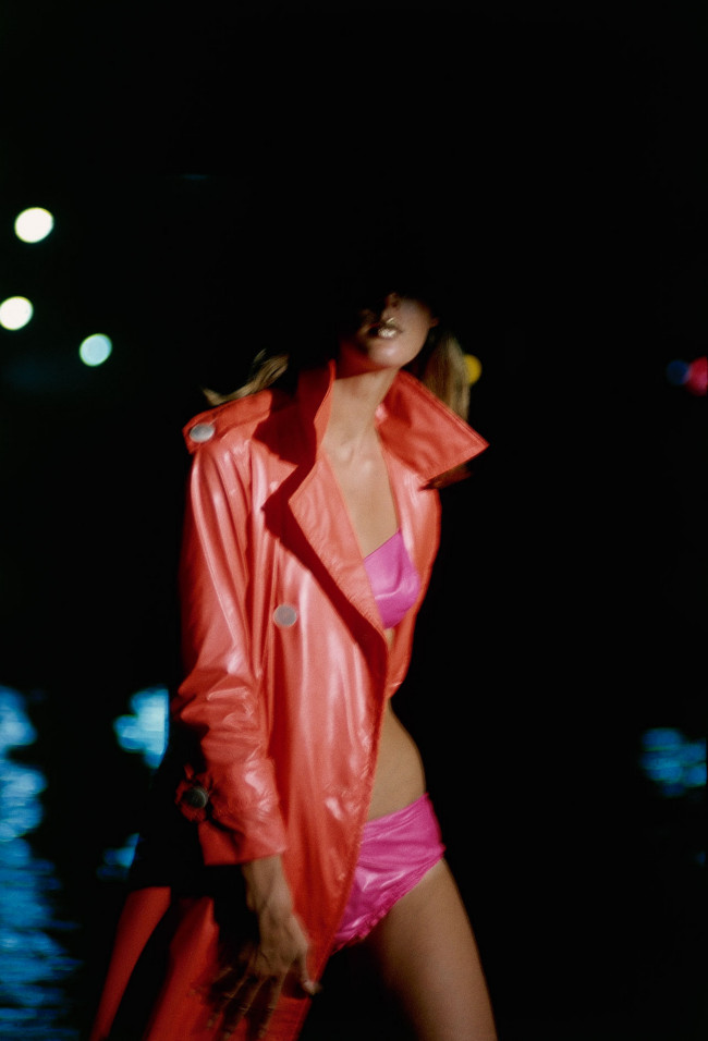 Neon at night! Model in bright pink bikini and orange trench coat, photographed by Sante Forlano, 1966.